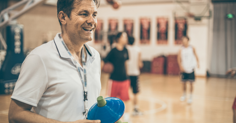 An experienced coach from Hey Coach training athletes through positive coaching