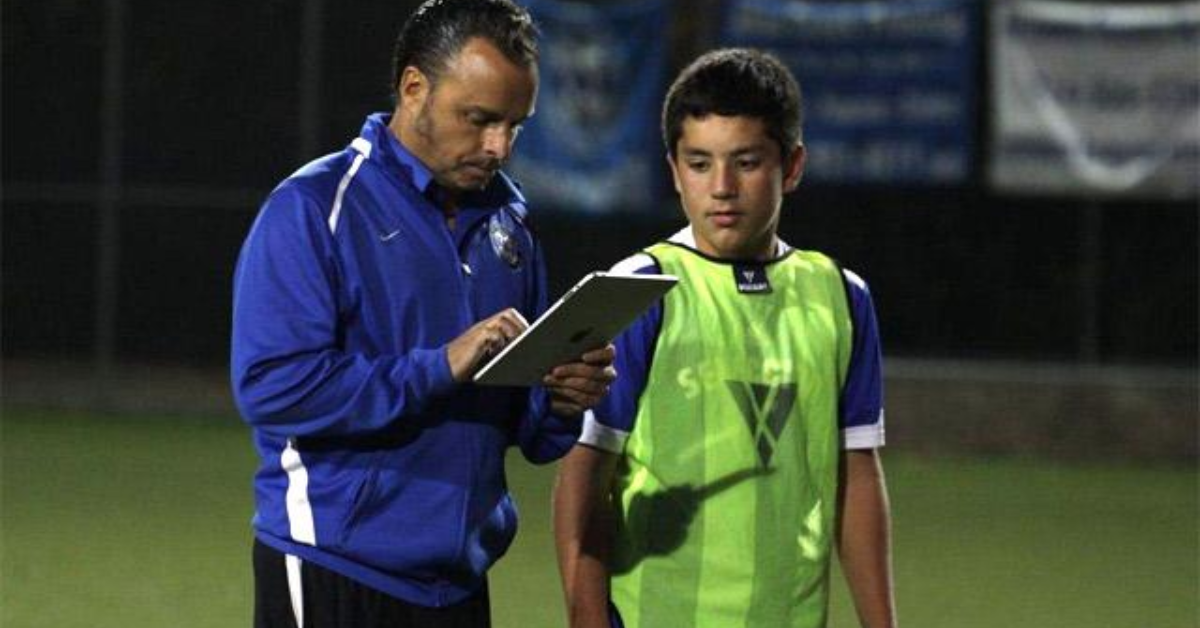 Hey Coach April Blog 1 Images sports coach using an app to track the progress of his athlete using Hey Coach